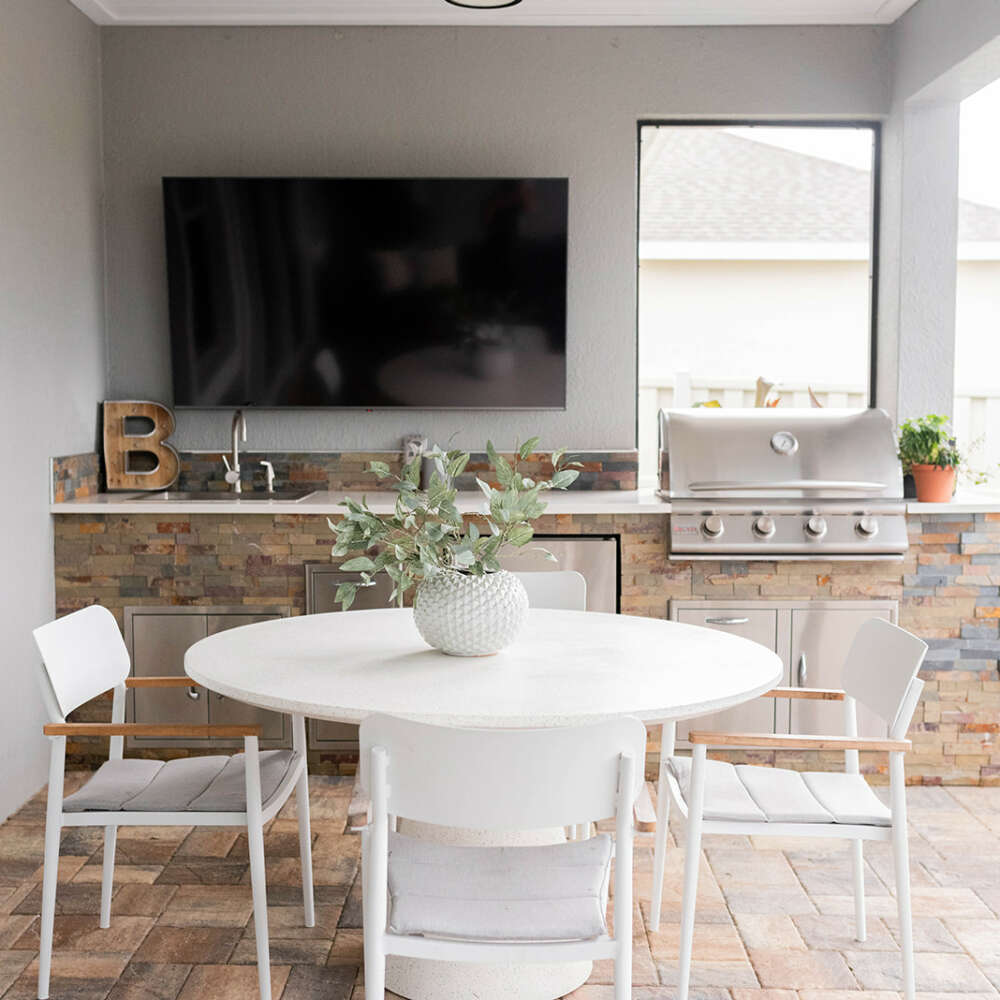 White dining table- bricks counter-silver meat grill