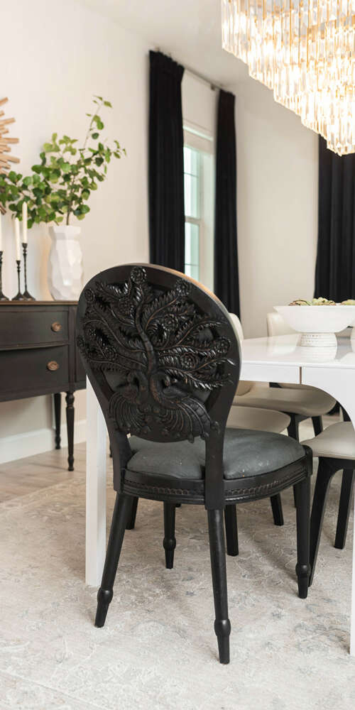 Dark chair dining table-ashen wood floor-light wall dining room